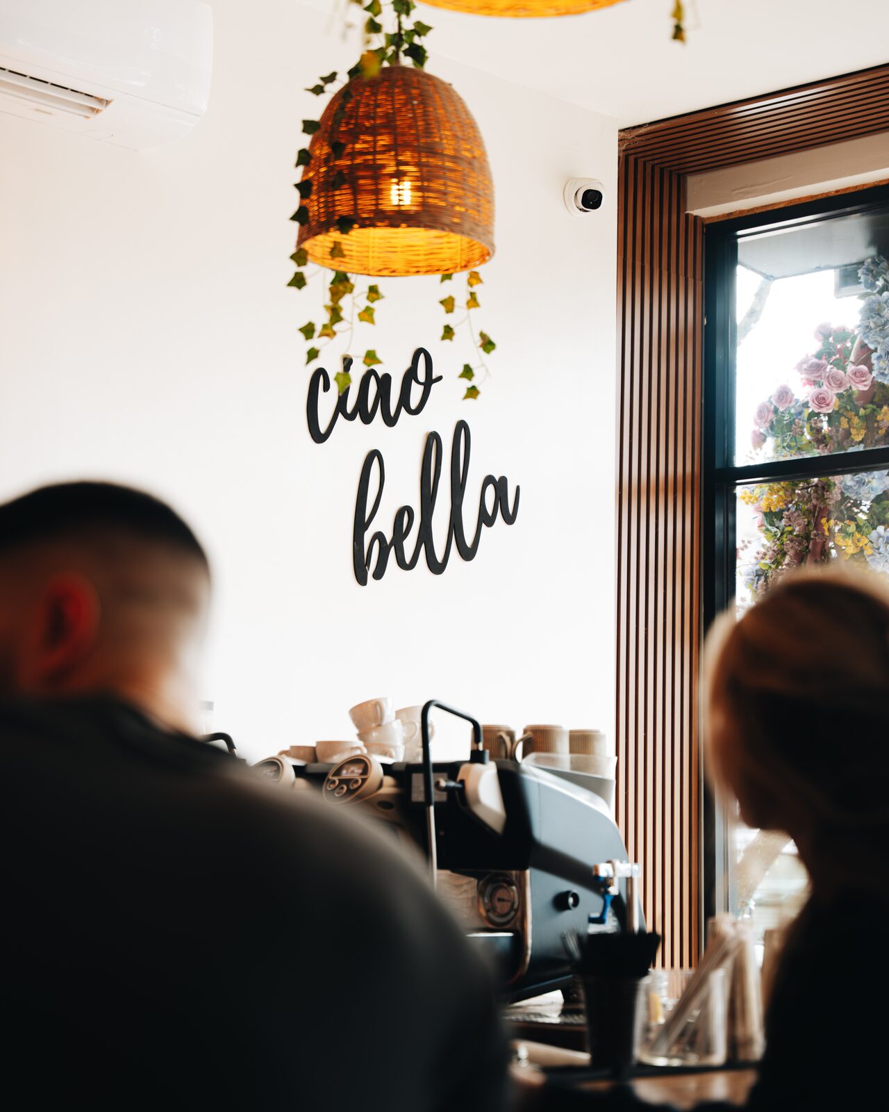 Perla cafe interior with ciao bella signage and espresso bar
